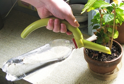 Portable Pourer Spout to Attach to Plastic Bottles for Watering plants.